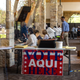 Poll workers help voters inside a polling location on October 13, 2020 in Austin, Texas.